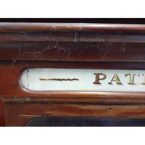 102 - A late 19th/early 20th century Patent Medicines Chemist display cabinet in mahogany with painted gla... 