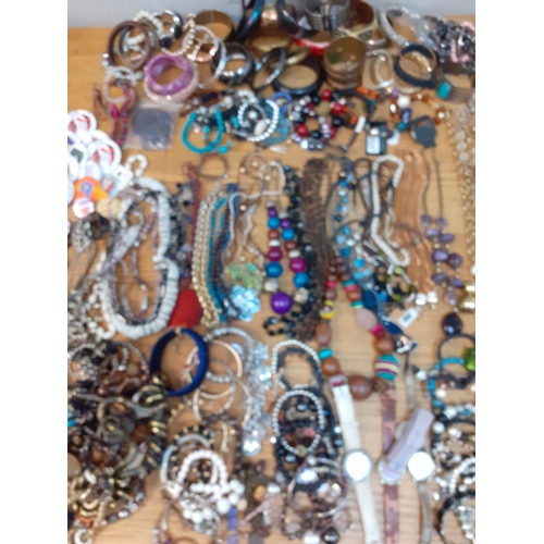 106 - A quantity of modern costume jewellery, mainly bangles and bead necklaces, together with four ladies... 