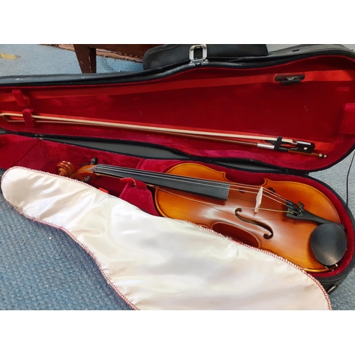 117 - An Intermusic student's violin and bow in fitted case.Location: RAM