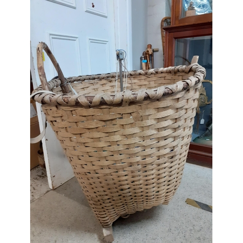 132 - A rustic woven grape carrying basket Location: G