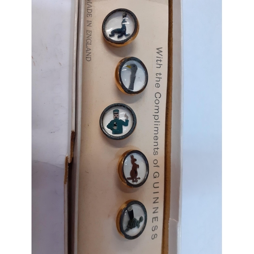 97 - A group of 5 (1 missing) gold tone and enamelled Guinness advertising shirt stays depicting images o... 