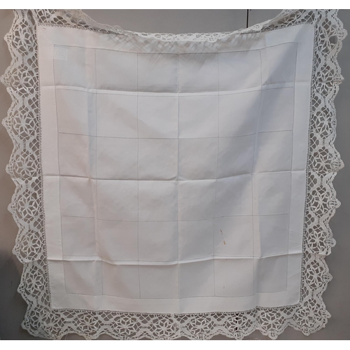 99 - A Mid 20th Century crotchet table cloth with embroidered circular white cotton insertions, 170cm x 1... 