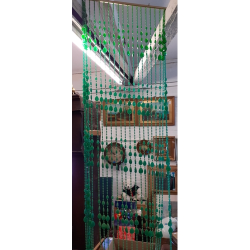 107 - A vintage green plastic bead door curtain 200cm L x 70cm w
Location: Ram/beams