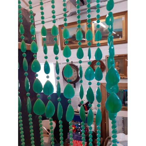 107 - A vintage green plastic bead door curtain 200cm L x 70cm w
Location: Ram/beams