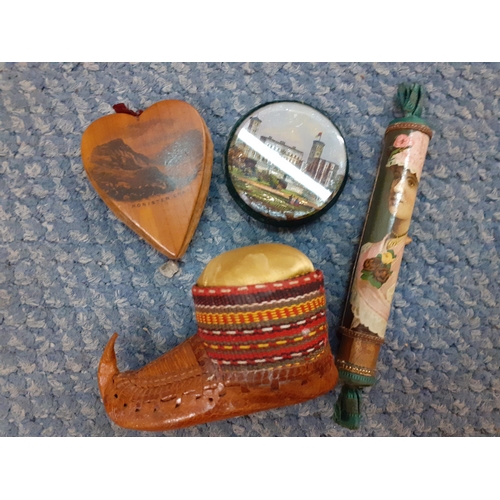 113 - A group of vintage pin cushions and sewing related items to include a British Empire Exhibition need... 