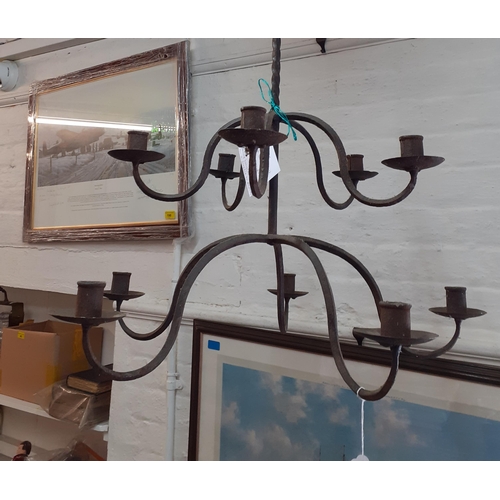 244 - A pair of wrought iron nine armed ceiling candelabras
Location: RWM/RWF UP