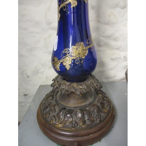 189 - A Victorian gilt metal and blue glass baluster table with trailed enamel grape and vine decoration, ... 