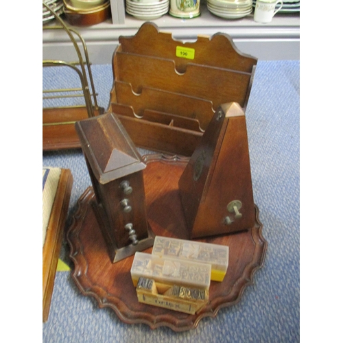 190 - A mixed lot to include a mahogany letter rack, a metronome, and an oak desk date calendar, a brass a... 