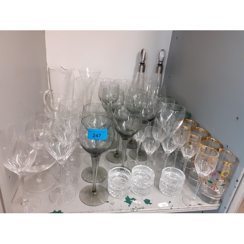 358 - Domestic glassware to include pedestal wine glasses and mixed decanters together with three table la... 