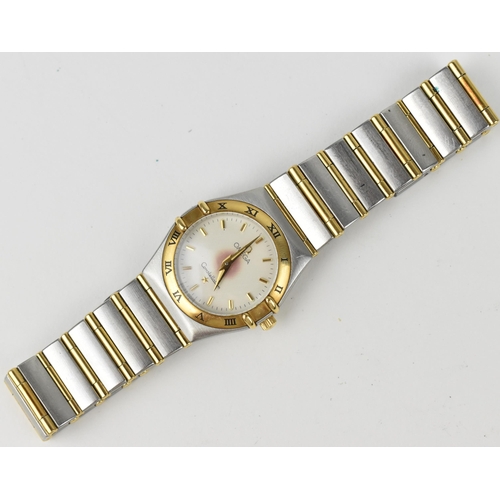 361 - An Omega quartz ladies gold and stainless steel wristwatch having a white enamel dial with gilt bato... 