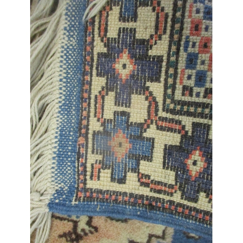 393 - Two hand woven rugs both having blue grounds, geometric designs and tasselled ends
Location: SR