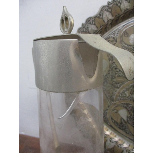 406 - A lot of mixed metalwork to include a secessionist cut glass claret jug with silver plated collar, l... 