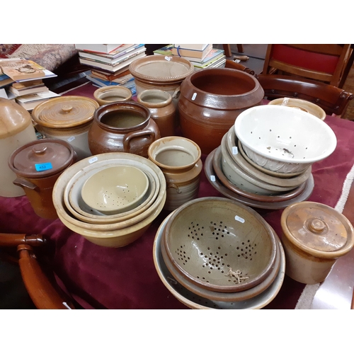 428 - A quantity of early 20th century kitchen stoneware storage jars, sieves and bowls
Location: G