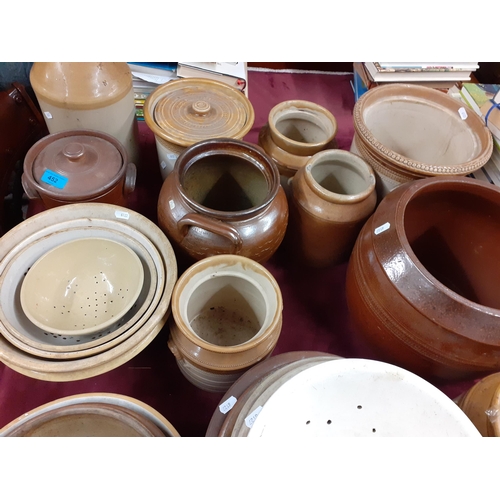 428 - A quantity of early 20th century kitchen stoneware storage jars, sieves and bowls
Location: G