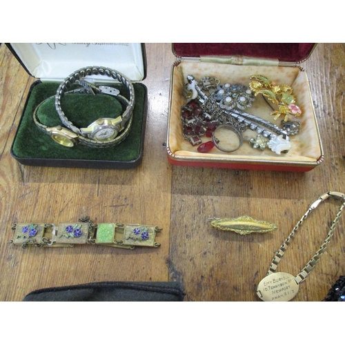 111 - A selection of costume jewellery and 2 ladies wristwatches, an evening bag, a sequinned beret and ot... 