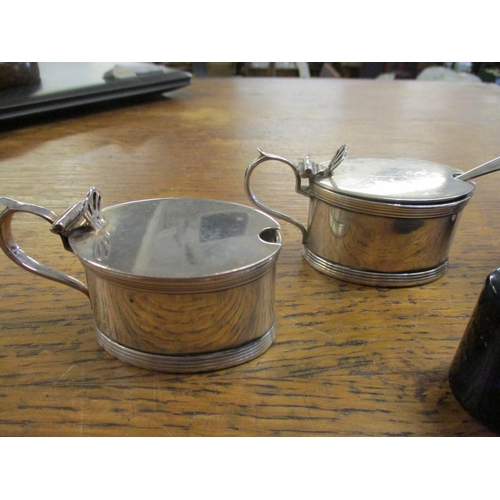 176 - Two Asprey & Co Ltd silver mustard pots, Chester 1911, with matching silver spoon, and two Edwardian... 