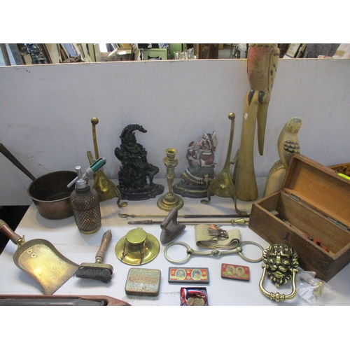 188 - A mixed lot of mainly metalware to include Punch and Judy painted cast metal door stops, brass desk ... 