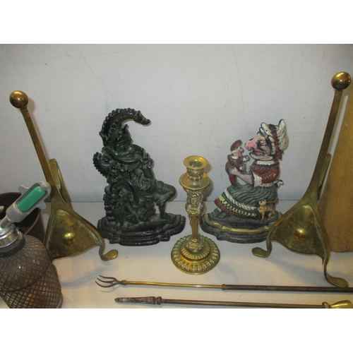 188 - A mixed lot of mainly metalware to include Punch and Judy painted cast metal door stops, brass desk ... 