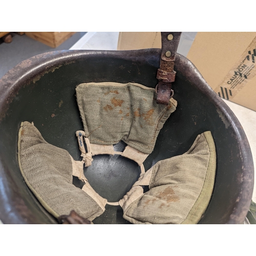 197 - A WWII era Russian steel infantry helmet with liner, a British 'Brodie' style steel helmet shell and... 