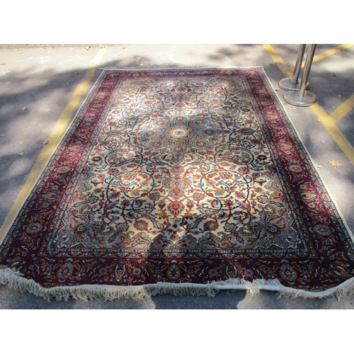 286 - A Egyptian rug hand woven in an Islamic floral design on a cream ground, with single wide guard bord... 