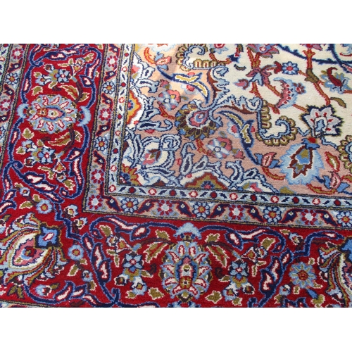 286 - A Egyptian rug hand woven in an Islamic floral design on a cream ground, with single wide guard bord... 