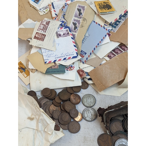 301 - A mixed lot of coins and stamps to include a quantity of Victorian and later pennies, George V and l... 