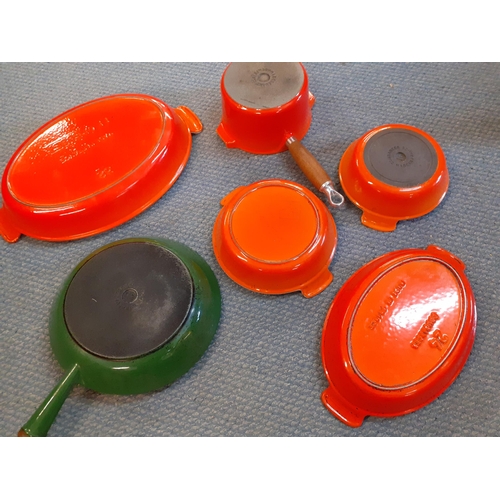 342 - Five Le Crueset and similar kitchen items to include a green enamelled frying pan and burnt orange o... 