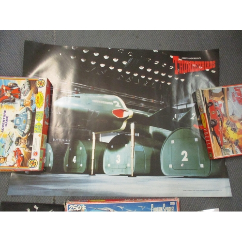 291 - Thunderbirds and Captain Scarlet items to include  jigsaws, board games, photos, publicity stills an... 