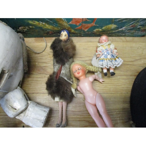 262 - A mixed lot to include a Pelham Puppets and painted wooden Indian elephant toy, three dolls, a Frenc... 