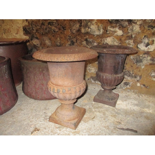 285 - A pair of metal cast iron garden urns, and three pottery garden pots Location: G