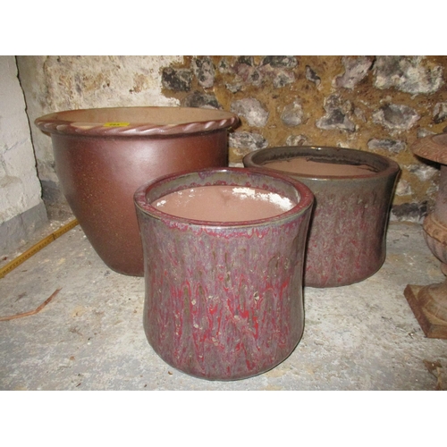 285 - A pair of metal cast iron garden urns, and three pottery garden pots Location: G