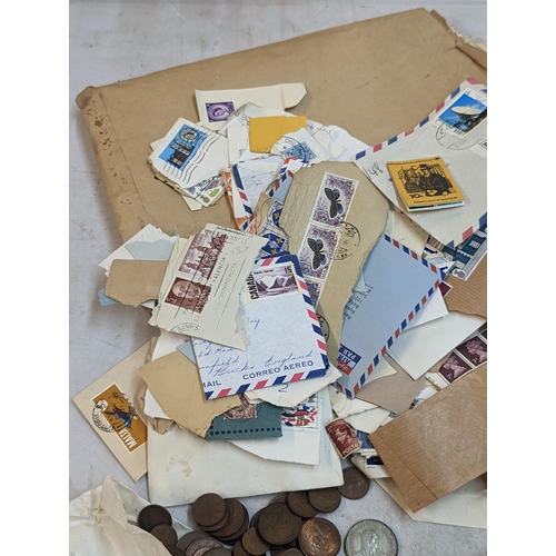 301 - A mixed lot of coins and stamps to include a quantity of Victorian and later pennies, George V and l... 