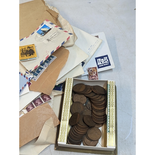 301 - A mixed lot of coins and stamps to include a quantity of Victorian and later pennies, George V and l... 