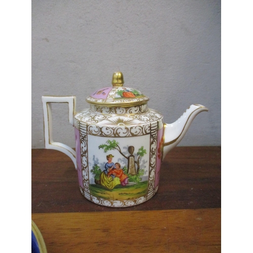 330 - A Sevres porcelain teapot and three coffee cans and saucers decorated with cherubs holding a flower ... 