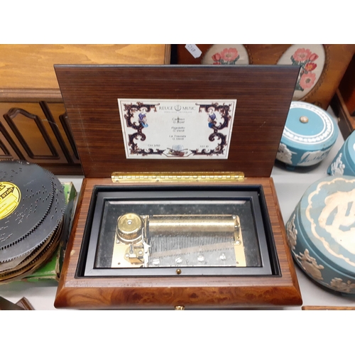 372 - A collection of late 20th century music boxes to include a Thorens A/F with records and a Reuge Musi... 