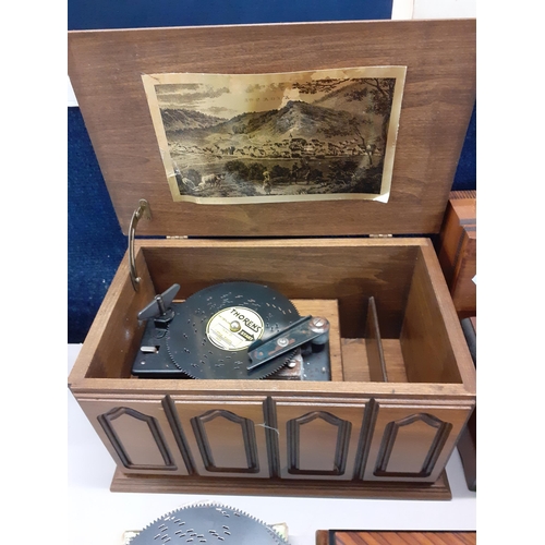 372 - A collection of late 20th century music boxes to include a Thorens A/F with records and a Reuge Musi... 