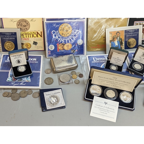 381 - A collection of silver proof coins and sets to include 1991-1995 WWII 50th anniversary set in case, ... 