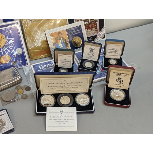 381 - A collection of silver proof coins and sets to include 1991-1995 WWII 50th anniversary set in case, ... 