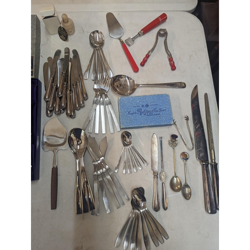 387 - A mixed collection of household cutlery to include boxed Edinburgh crystal knives, silver plate flat... 