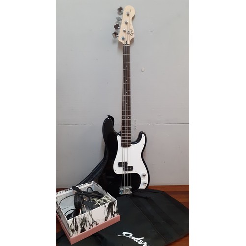 127 - A Fender Squier bass guitar made in Indonesia, serial number s/niCS13195747, a Fender guitar soft ca... 