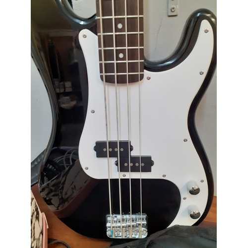 127 - A Fender Squier bass guitar made in Indonesia, serial number s/niCS13195747, a Fender guitar soft ca... 