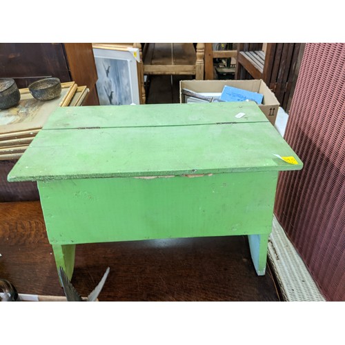 343 - A Lloyd Loom style, white painted two tier table with matching stool, a pink painted laundry basket ... 