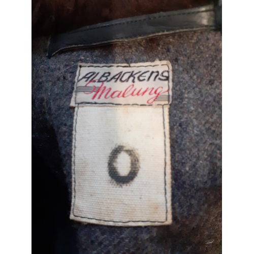 20 - German Uniform - German Officers overcoat. Black leather with utility buttons and brown fur lined co... 