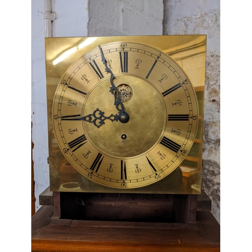 103 - A mid 20th century walnut and oak cased grandmother clock, the brass dial inscribed R B Horstmann Co... 