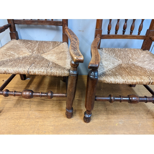 95 - Two similar fruit wood, elm and ash Sussex chairs, with spindle backs and low seats Location: G