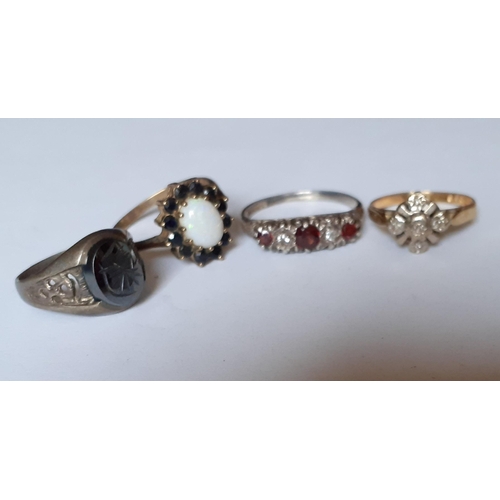 194 - An 18ct illusion dress ring, 2.18g together with a silver dress ring with red and white cabochons, t... 