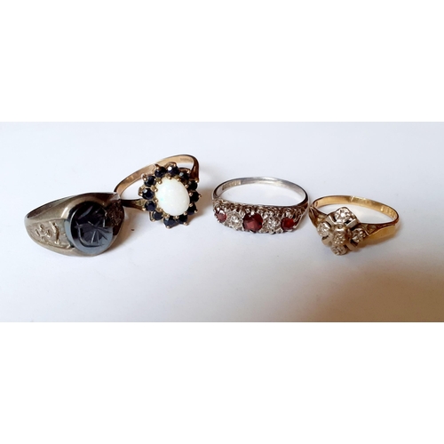 194 - An 18ct illusion dress ring, 2.18g together with a silver dress ring with red and white cabochons, t... 