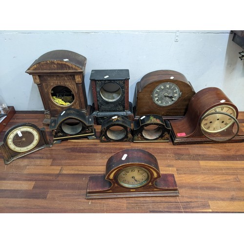 186 - The component parts of clocks and cases to include mainly early 20th century examples, three Chinois... 