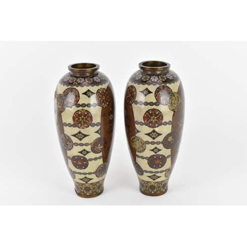 11 - A pair of Japanese Meiji/Taisho period cloisonne enamel vases, each with central goldstone ground ca... 