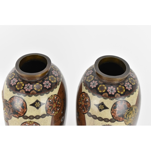 11 - A pair of Japanese Meiji/Taisho period cloisonne enamel vases, each with central goldstone ground ca... 